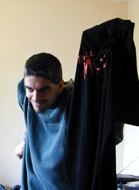me holding new shirt